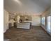 Open-concept kitchen with stainless steel appliances, a large island, and lots of natural light at 5314 Tolar Rd # 23, South Fulton, GA 30213