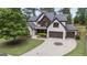 Overhead shot of a beautiful home with a circular driveway and mature landscaping, surrounded by lush greenery at 2265 Venture Dr, Marietta, GA 30062
