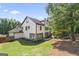 Expansive home exterior with large windows, patio space, and a spacious lawn perfect for outdoor activities at 2265 Venture Dr, Marietta, GA 30062