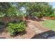 Backyard featuring a stone pathway leading up to a secluded area with a privacy fence and mulched ground at 2265 Venture Dr, Marietta, GA 30062