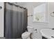 Classic bathroom with gray shower curtain, window, and modern fixtures at 2265 Venture Dr, Marietta, GA 30062