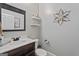 Half bathroom featuring a white vanity and a decorative flower accent at 2265 Venture Dr, Marietta, GA 30062