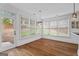 Bright breakfast nook with hardwood floors, large windows, and modern light fixture at 2265 Venture Dr, Marietta, GA 30062