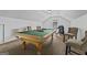 Upstairs game room featuring a pool table and chairs under the pitched roof at 2265 Venture Dr, Marietta, GA 30062