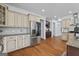 Well-lit kitchen with stainless steel appliances, custom cabinetry, and hardwood floors at 2265 Venture Dr, Marietta, GA 30062