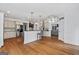 Open kitchen with granite countertops, stainless steel appliances, a breakfast bar, and hardwood floors at 2265 Venture Dr, Marietta, GA 30062