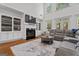 Inviting living room featuring a fireplace, built-in shelves, and a comfortable gray sectional sofa at 2265 Venture Dr, Marietta, GA 30062