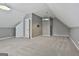 A spacious bonus room or bedroom with neutral carpet and gray walls featuring an overhead light at 100 Concord Ct, Fayetteville, GA 30214