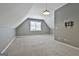 A bonus room bedroom featuring neutral carpet, gray walls, a window with blinds, and an overhead light at 100 Concord Ct, Fayetteville, GA 30214