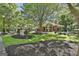 Well-maintained community center with a playground, verdant lawn, and landscaping at 100 Concord Ct, Fayetteville, GA 30214