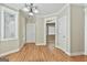 Well-lit Dining Room with hardwood floors and adjacent doorway to other living spaces at 100 Concord Ct, Fayetteville, GA 30214