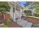 Inviting front porch with traditional columns and American flag at 100 Concord Ct, Fayetteville, GA 30214