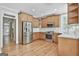Beautiful kitchen featuring stainless steel appliances, hardwood floors, and modern white backsplash at 100 Concord Ct, Fayetteville, GA 30214