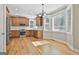 Spacious kitchen featuring stainless steel appliances, hardwood floors, and bright breakfast nook at 100 Concord Ct, Fayetteville, GA 30214