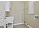 Bright laundry room features a utility sink, storage cabinets, and convenient washer/dryer hookups at 100 Concord Ct, Fayetteville, GA 30214