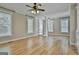 Bright living room with hardwood floors, crown moulding, and large windows at 100 Concord Ct, Fayetteville, GA 30214