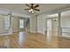 Open living space with hardwood floors, staircase, and large openings into other living spaces at 100 Concord Ct, Fayetteville, GA 30214