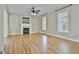 Spacious living room featuring a fireplace, hardwood floors, and windows at 100 Concord Ct, Fayetteville, GA 30214