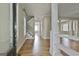 Inviting living room with hardwood floors and staircase with iron spindles at 100 Concord Ct, Fayetteville, GA 30214