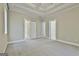 Generous bedroom with neutral carpet, trim details, and entry to a Primary bathroom at 100 Concord Ct, Fayetteville, GA 30214