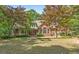 Charming brick home with landscaped backyard and mature trees, perfect for outdoor enjoyment and relaxation at 9274 Betony Wood Trl, Jonesboro, GA 30236