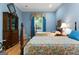 Charming bedroom with hardwood floors, two beds with ornate bedding, and ample natural light at 9274 Betony Wood Trl, Jonesboro, GA 30236