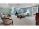 Charming bedroom with blue walls offers a comfortable seating area and a window seat at 9274 Betony Wood Trl, Jonesboro, GA 30236
