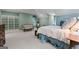 Bright and airy bedroom features a plush bed, seating area, and built-in shelving at 9274 Betony Wood Trl, Jonesboro, GA 30236