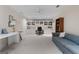 Spacious bonus room features neutral carpet, large window and a ceiling fan at 9274 Betony Wood Trl, Jonesboro, GA 30236