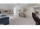 Spacious bonus room features neutral carpet, large window and a ceiling fan at 9274 Betony Wood Trl, Jonesboro, GA 30236