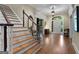 Welcoming foyer with hardwood floors, staircase, and views of the entryway at 9274 Betony Wood Trl, Jonesboro, GA 30236