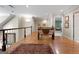 Bright upstairs hallway with a view overlooking the living room at 9274 Betony Wood Trl, Jonesboro, GA 30236
