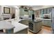 Spacious kitchen featuring a central island, custom cabinets, and modern appliances at 9274 Betony Wood Trl, Jonesboro, GA 30236