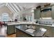 Bright kitchen with high ceilings, large windows, custom cabinets, and a kitchen island at 9274 Betony Wood Trl, Jonesboro, GA 30236