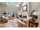 Cozy living room features a fireplace, lots of natural light and hardwood floors at 9274 Betony Wood Trl, Jonesboro, GA 30236