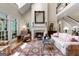 Inviting living room with a fireplace, large windows and decorative rug creates a warm ambiance at 9274 Betony Wood Trl, Jonesboro, GA 30236