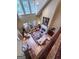 High-angle shot of a living room with a fireplace and lots of natural light at 9274 Betony Wood Trl, Jonesboro, GA 30236
