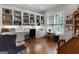 Office with hardwood floors and built-in shelving and cabinets at 9274 Betony Wood Trl, Jonesboro, GA 30236