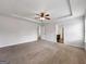 Spacious main bedroom featuring neutral carpet, recessed lighting, and a ceiling fan at 789 Galveston Way, Mcdonough, GA 30253