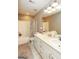 Bright bathroom featuring double sinks, a shower with curtain, and a neutral color scheme at 208 Summer Chase, Carrollton, GA 30116
