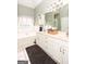 Bright bathroom with soaking tub, double vanity, and modern fixtures at 208 Summer Chase, Carrollton, GA 30116