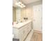 Bathroom featuring double sinks, white cabinets, a mirror, and neutral paint at 208 Summer Chase, Carrollton, GA 30116