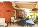 Covered patio with brick columns, outdoor furniture, and a view of the backyard at 208 Summer Chase, Carrollton, GA 30116