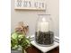 Interior decor displaying decorative candle, driftwood cross and the home's location's GPS coordinates at 208 Summer Chase, Carrollton, GA 30116