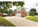 Spacious brick home with a wide driveway, attached garage, and well-kept lawn at 208 Summer Chase, Carrollton, GA 30116