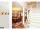 Bright foyer showcasing a staircase, hardwood floors, and access to dining and living areas at 208 Summer Chase, Carrollton, GA 30116