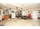 Spacious garage with a trailer, storage shelves, and organized tools at 208 Summer Chase, Carrollton, GA 30116