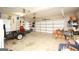 Spacious two car garage with ample room for storage and vehicle parking with a white door at 208 Summer Chase, Carrollton, GA 30116