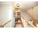 Upstairs hallway with hardwood floors, natural light, and an open view to the living area below at 208 Summer Chase, Carrollton, GA 30116