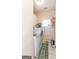 Efficient laundry room with modern washer and dryer, storage cabinets, and natural light from the window at 208 Summer Chase, Carrollton, GA 30116